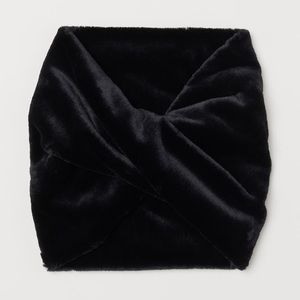 H&M Tube scarf in faux fur with a twisted detail at front.